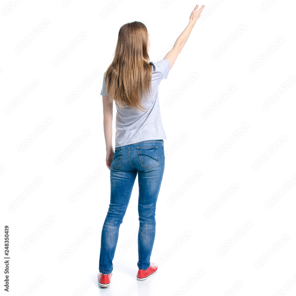 Woman in jeans t-shirt showing holding on white background isolation, back view Woman in jeans t-shirt showing holding on white background isolation, back view