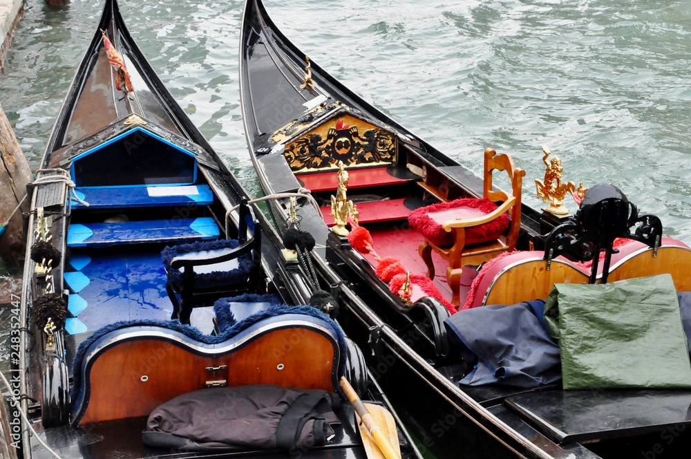 Pair of Venetian gondolas waiting for the tourists