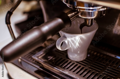Closeup of making espresso with profesional espresso machine at the coffee shop.