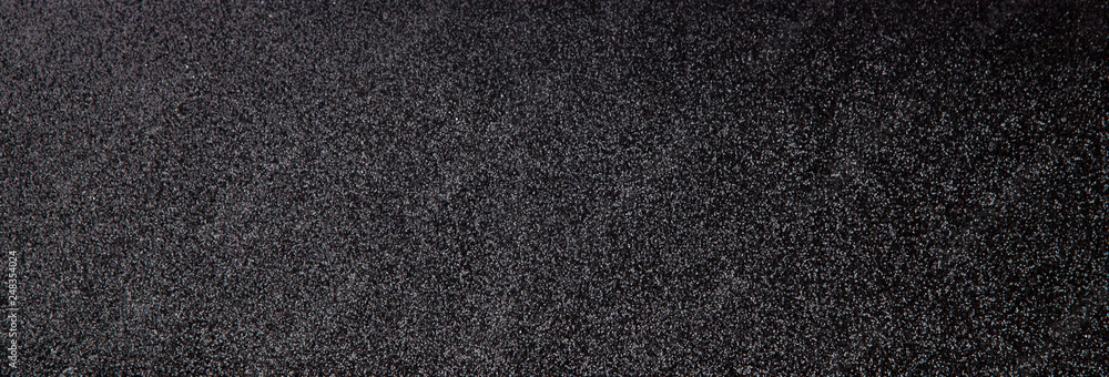 Silver sequins pattern. Sparkling sequins on black wool fabric as background Silver sequins pattern. Sparkling sequins on black wool fabric as background