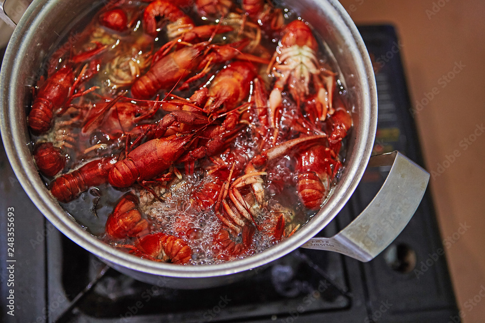 Crawfish cooking boiling in pot with spices Crawfish cooking boiling in pot with spices