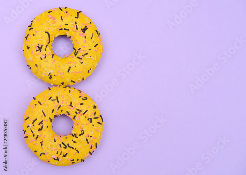 Donut on light violet background