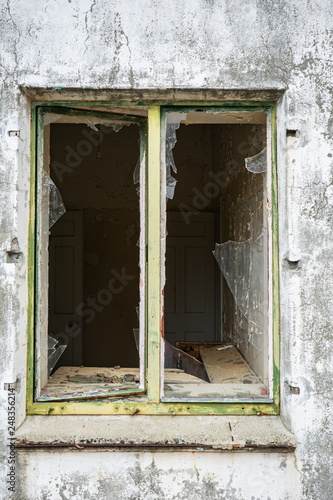 Opened window glass broken to an abandon building