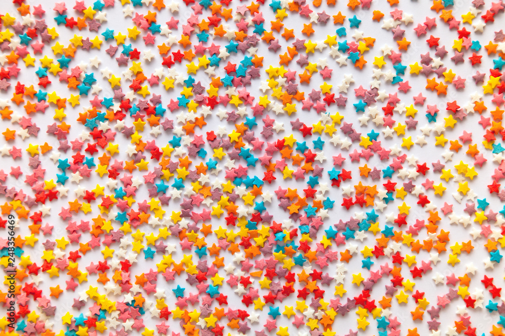 Colorful Sugar Star And Flower Sprinkles Background Stock Photo