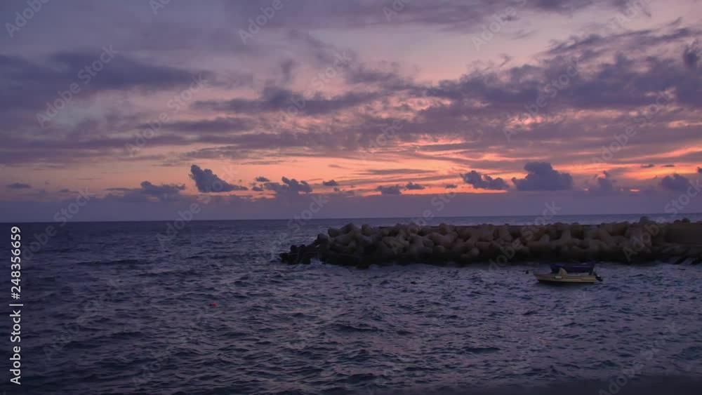 Coastline in Funchal, Madeira. Colorful sunset on the beach in capitol of Madeira. Coastline in Funchal, Madeira. Colorful sunset on the beach in capitol of Madeira.