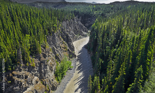 Kuskulana River Canyon in the places where McCarthy Road crosses on it in the Wrangell Mountains. The Wrangell Mountains are a high mountain range of eastern Alaska, UNESCO World Heritage Site photo