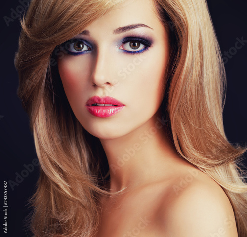 Portrait of a beautiful young woman with long white hairs