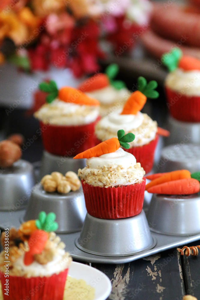 Easter cupcakes baked with carrot decorated with small figures Easter cupcakes baked with carrot decorated with small figures