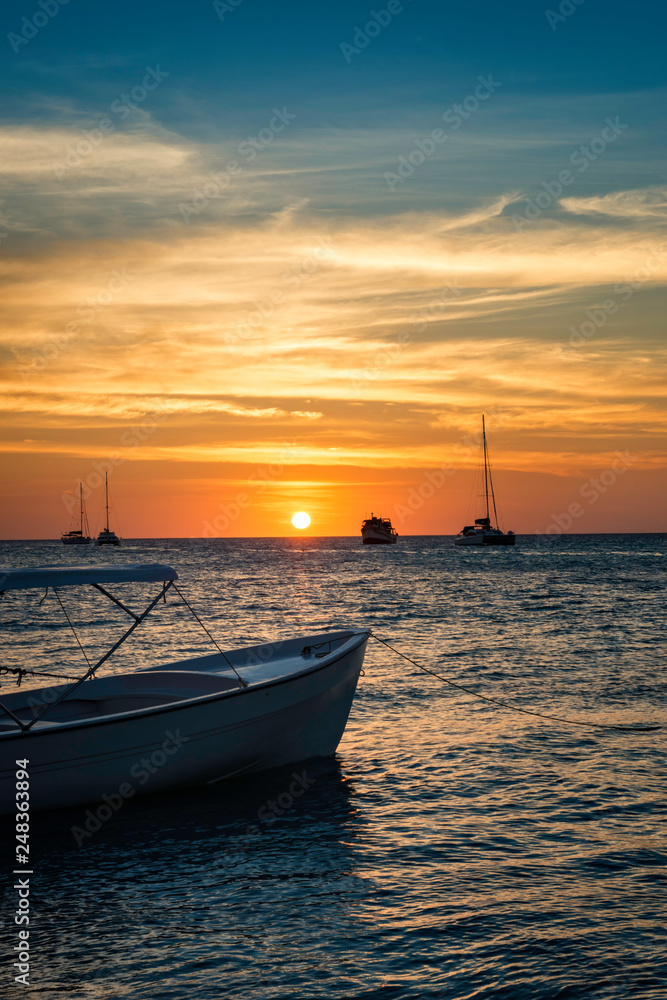 Sunset with boats at Los Roques Archipelago in Beautiful Venezuela