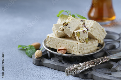 Oriental sweets - halva with pistachios photo