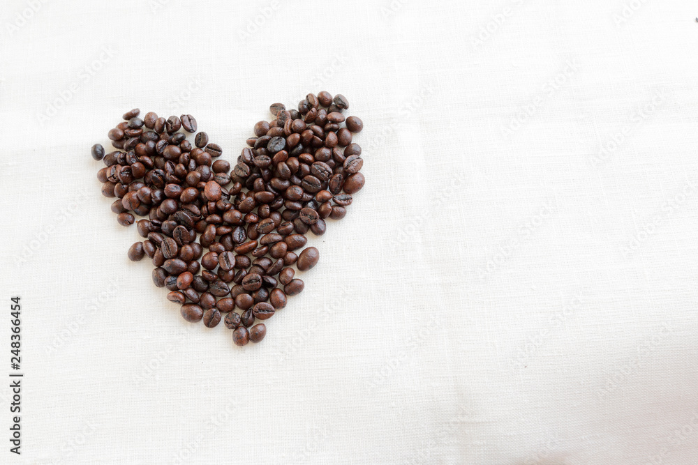 coffee beans in shape of heart on white background coffee beans in shape of heart on white background