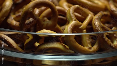 Pretzel salted in rotation. Close up. Studio shot. Unhealthy diet concept. Junk food concept.