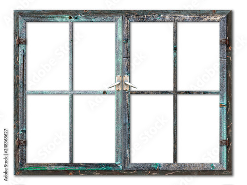 Very aged wooden window frame with cracked paint on it, mounted on a grunge wall