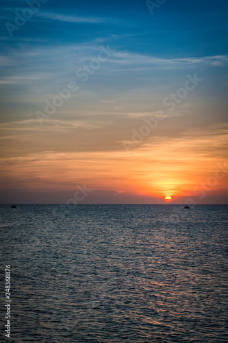 Beautiful Sunset over the Oceans Horizon at Los Roques, Venezuela © Douglas