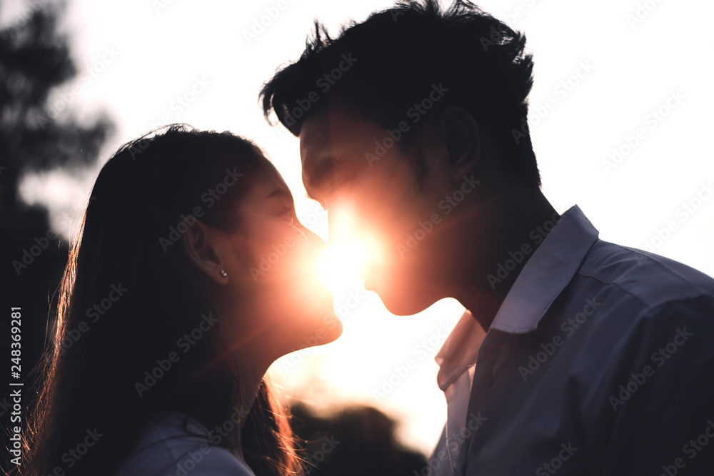 Young lovers kissing during their romantic date on Valentine's day