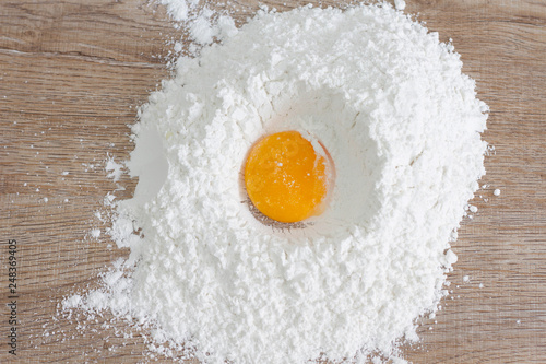 flour and eggs on wooden table