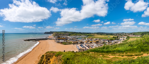 BRIDPORT, DORSET, UK - 6JUN2018: West Bay from cliffs to the East. Inland, the town of Bridport can also be seen.