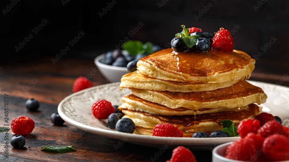 Homemade american pancakes with fresh blueberry, raspberries and honey. Healthy morning breakfast. rustic style - obrazy, fototapety, plakaty 
