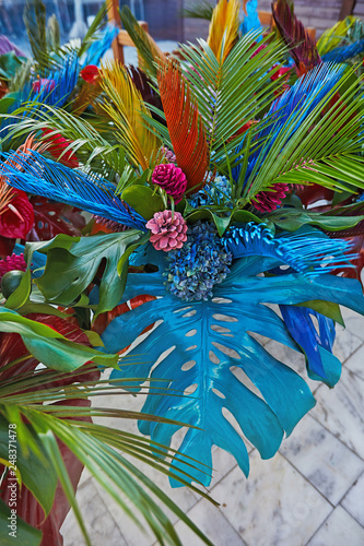 Bouguets of monstera for tables decoration on wedding or corporative event