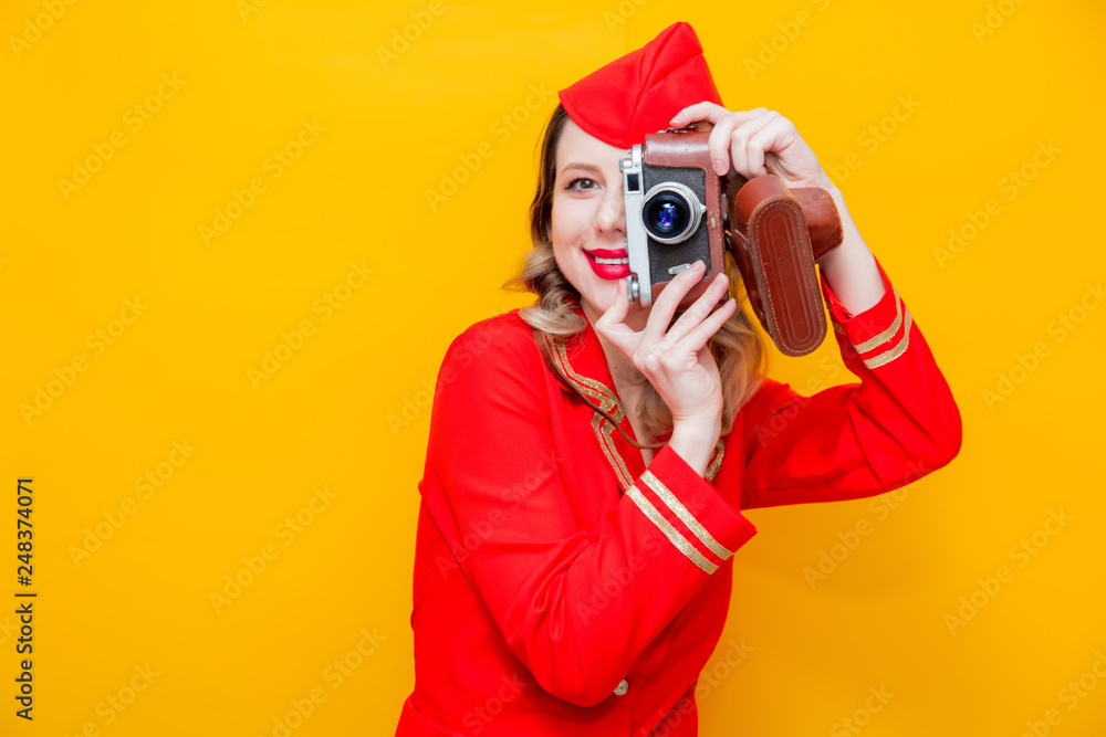 stewardess wearing in red uniform with photo camera stewardess wearing in red uniform with photo camera
