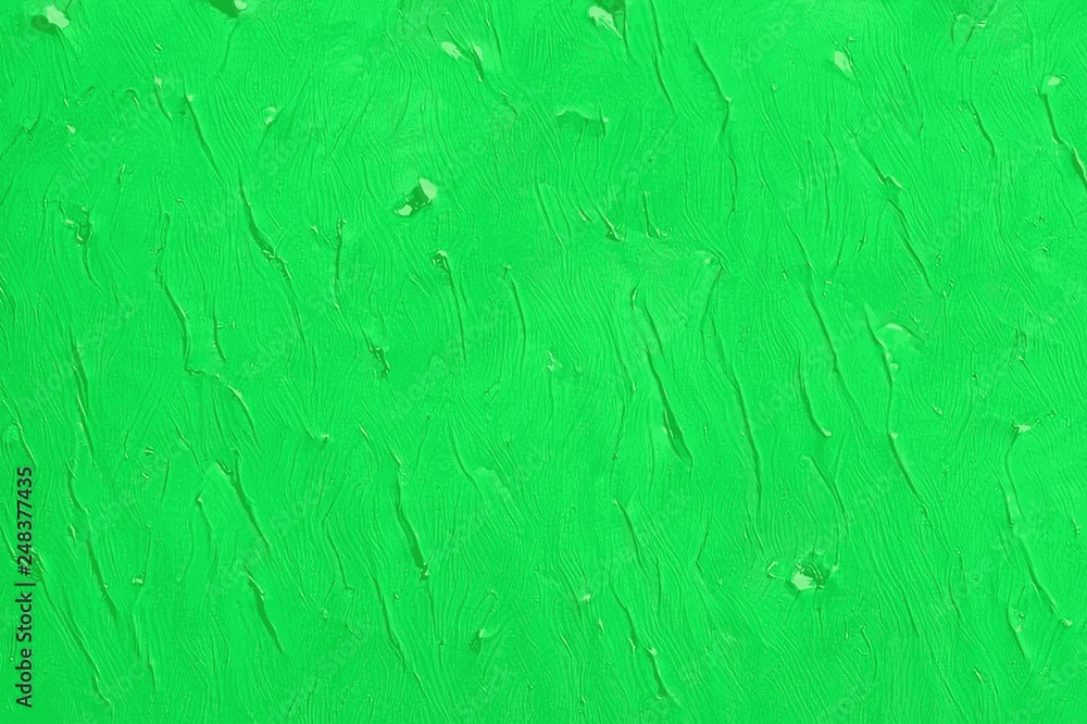 Coagulated texture of green thick acrylic paint on a canvas