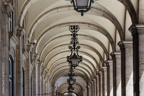 Long arches tunnel with lampposts
