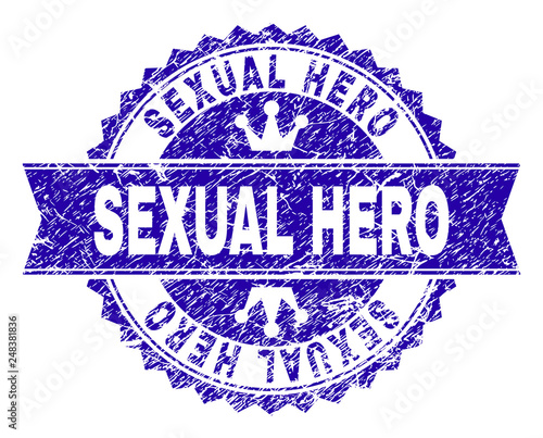 SEXUAL HERO rosette seal overlay with distress texture. Designed with round rosette, ribbon and small crowns. Blue vector rubber print of SEXUAL HERO caption with scratched texture.