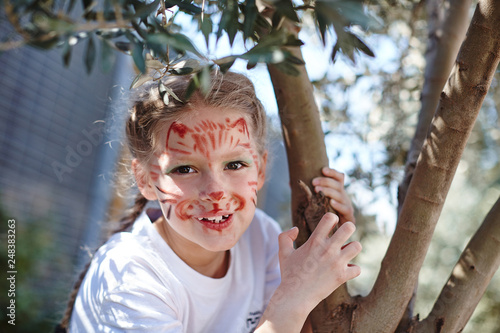 Wallpaper Mural Cute girl with face cat make up on birthday smiling roaring like small tiger Torontodigital.ca