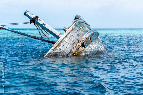 Shipwreck in Vaavu Atoll near Keyohoo Island, Maldives photo