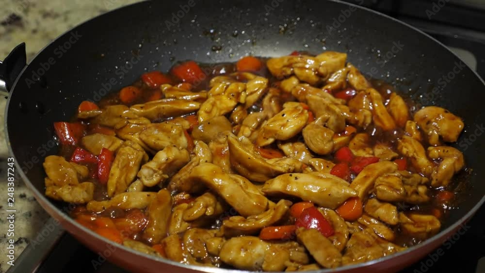 Cook teriyaki chicken on frying pan, closeup Cook teriyaki chicken on frying pan, closeup