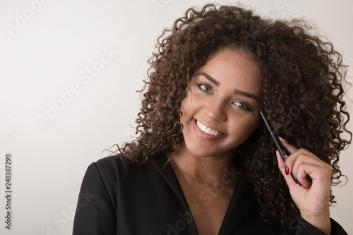 Business black woman on a grey background