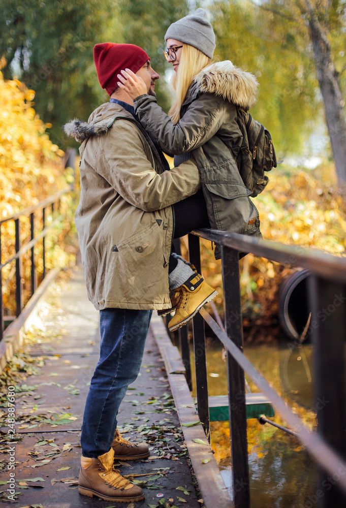Two young travel couple walking on bridge Two young travel couple walking on bridge