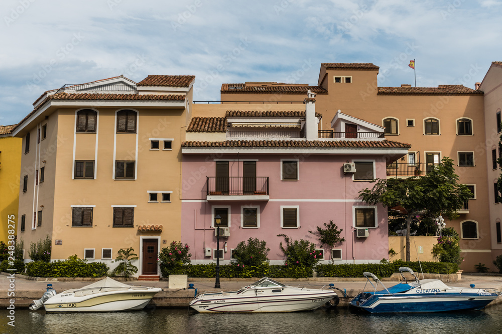 Colorful houses with boats in port