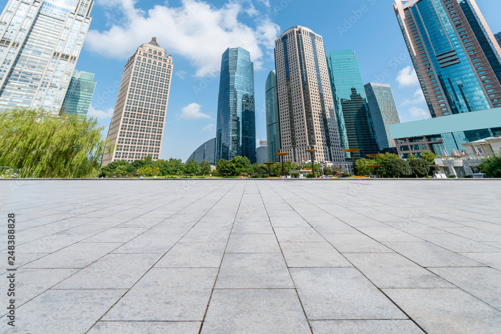 Empty square floor tiles and skyline of modern urban buildings in Shanghai.. Empty square floor tiles and skyline of modern urban buildings in Shanghai..