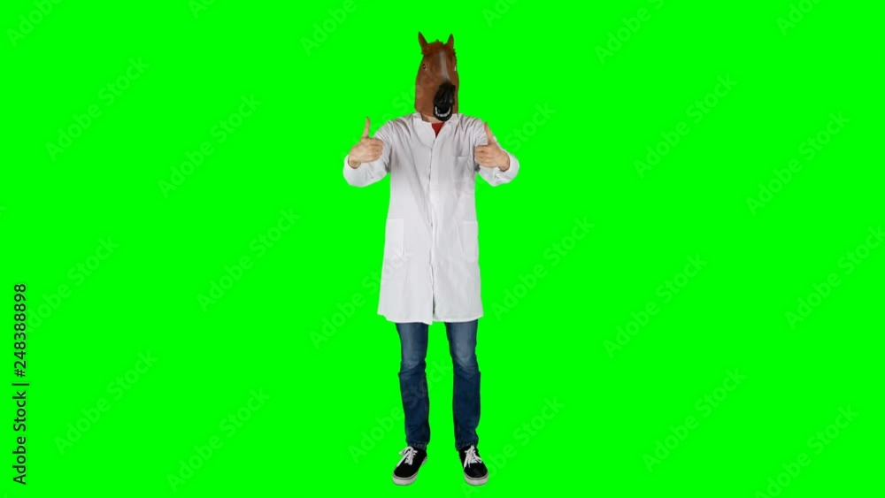 Funny Doctor Chemist in Horse Mask Giving Like Thumbs Down on a Green Screen Funny Doctor Chemist in Horse Mask Giving Like Thumbs Down on a Green Screen