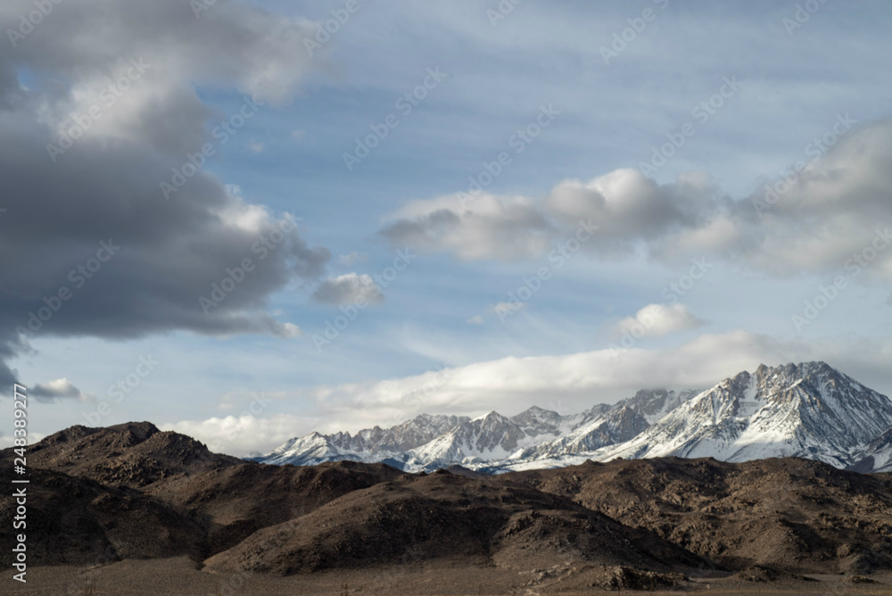 Eastern Sierra Nevada snowy mountain peaks and brown winter hills