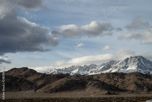 Eastern Sierra Nevada snowy mountain peaks and brown winter hills