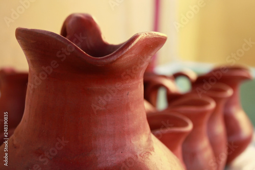 Ceramic pottery vase containing Chicha de Jora, a Peruvian alcoholic drink