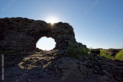 Natural arch,view of a sunny landscape,lava field,Krafla volcanic system, Dimmuborgir National Park, Myvatn,Iceland. photo