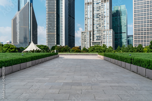 Empty square floor tiles and skyline of modern urban buildings in Shanghai.. © 昊 周