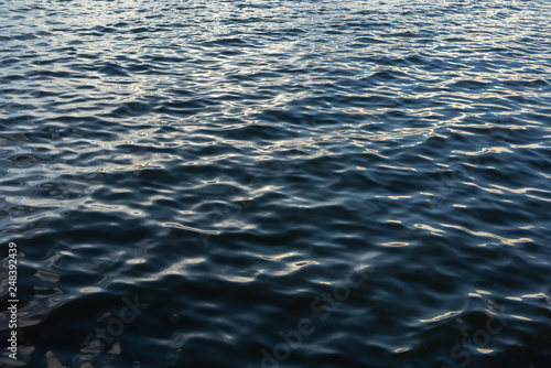 Dark blue ripple water and surface. Beautiful motion wave.