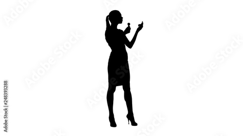 Silhouette Facial Makeup. Young Female Model Putting Blush With Cosmetic Brush. photo