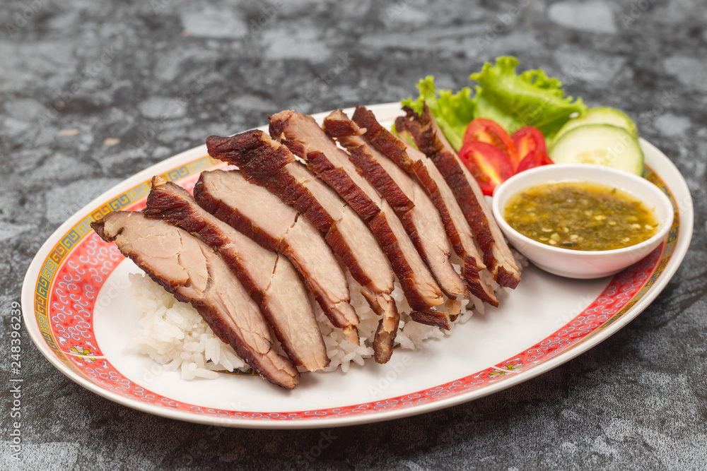 Fried pork with garlic or steak on rice and cucumber. Fried pork with garlic or steak on rice and cucumber.