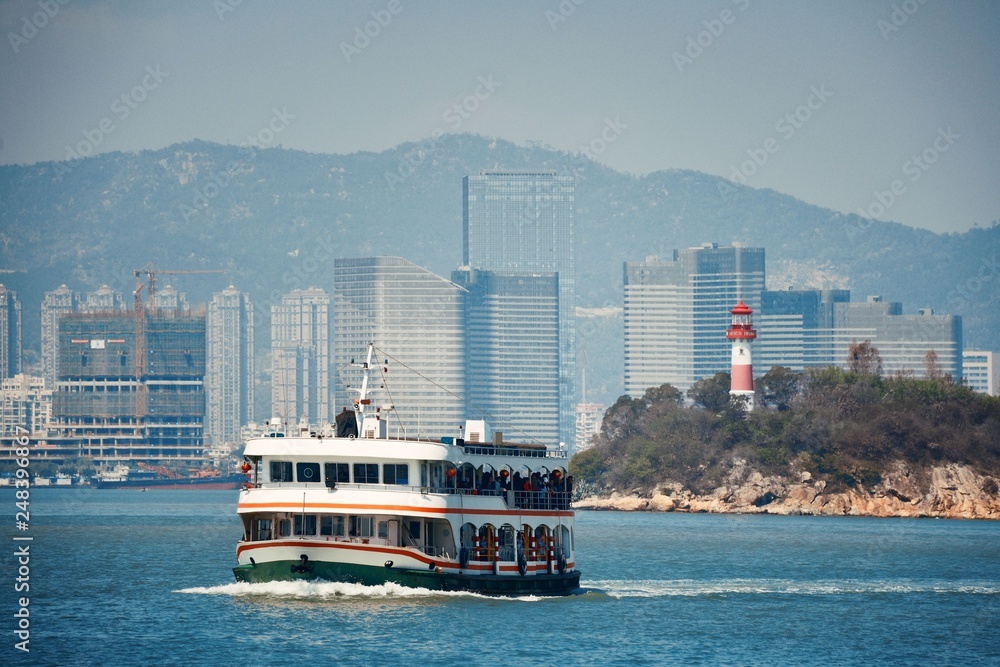 Boat and Xiamen city skyline