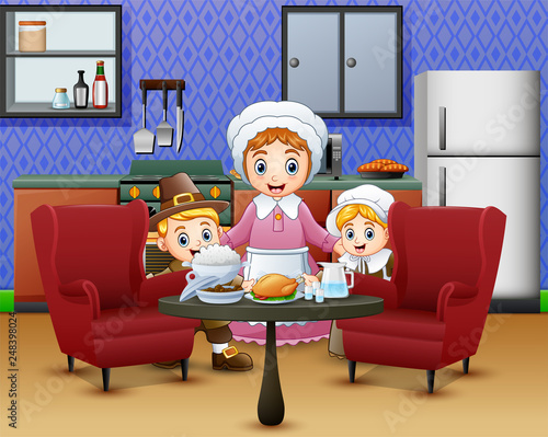 Happy children and mom near food at the dinner table