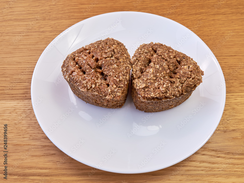 homemade rye bread lying on a white plate. top view homemade rye bread lying on a white plate. top view
