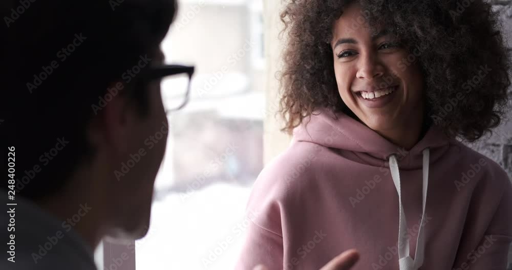 Happy mixed race couple spending leisure time together at home Happy mixed race couple spending leisure time together at home