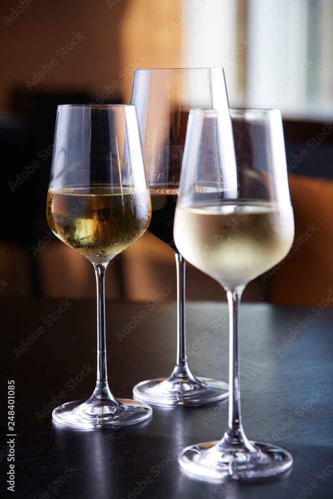 Glasses of wine on table