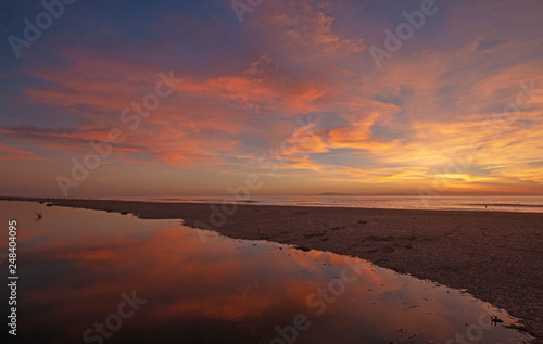 Sunset cloud reflection over Santa Clara river seaside marsh at Ventura beach in California United States