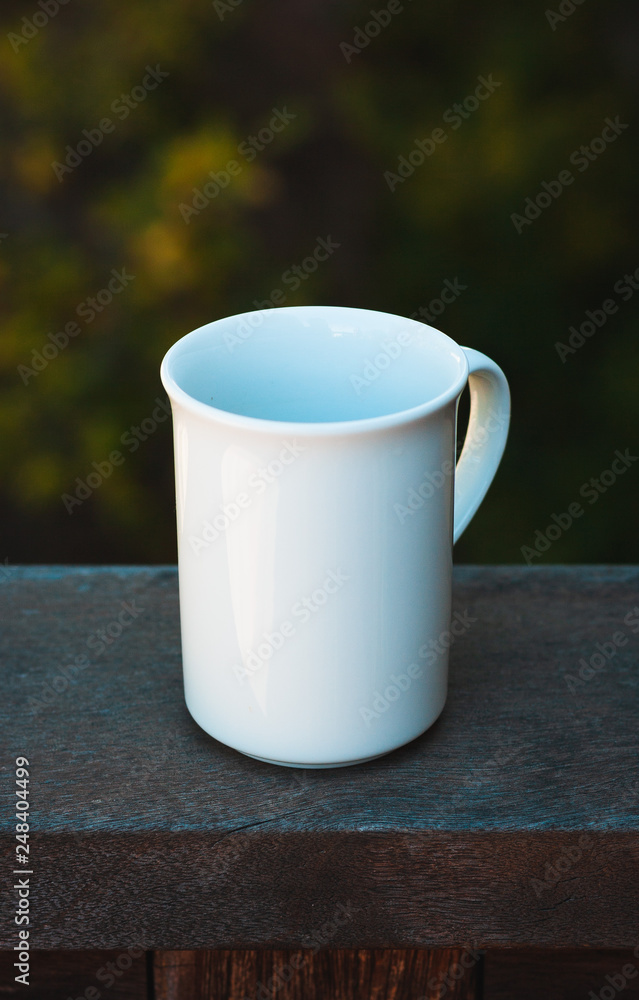 Obraz premium white cup on wooden background
